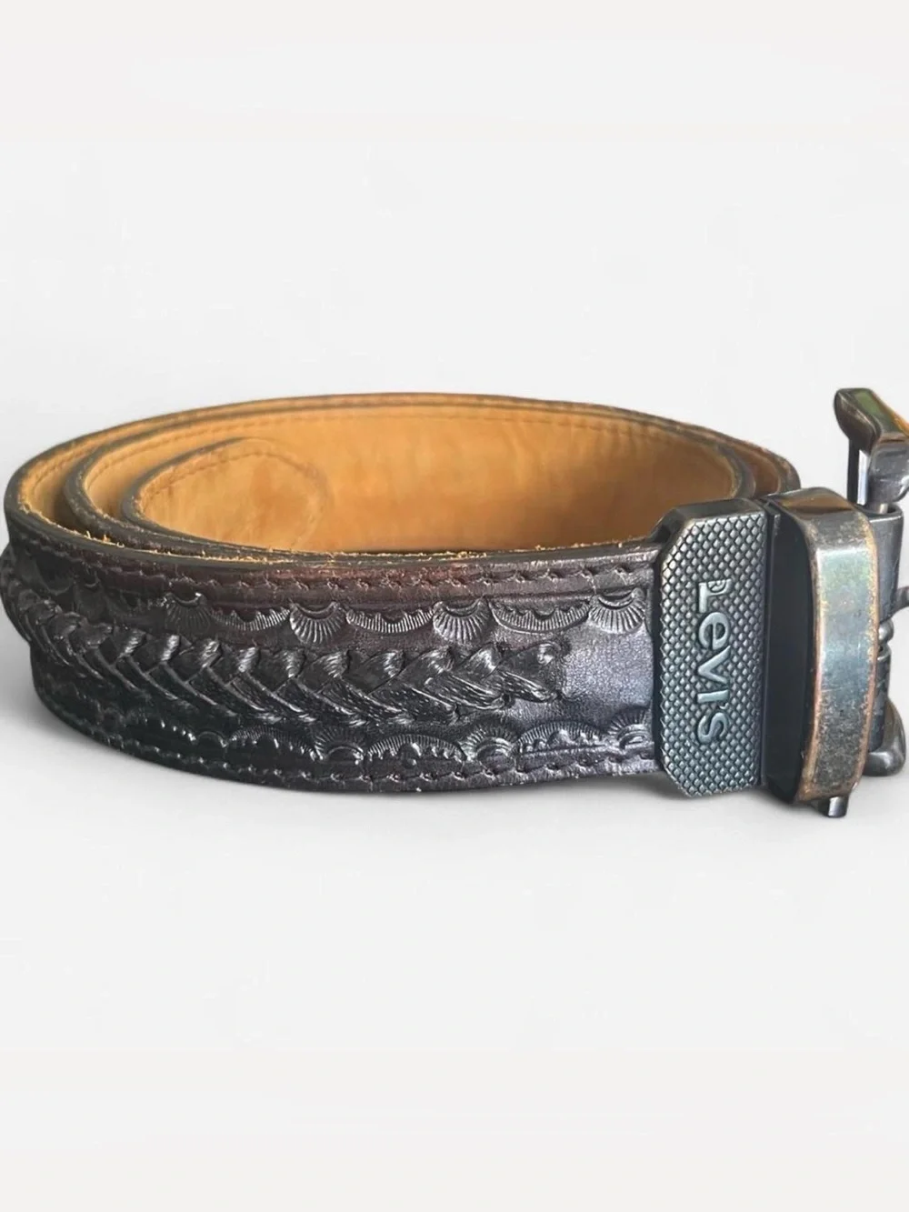 Vintage Levi's black tooled leather western belt with rotating harness buckle